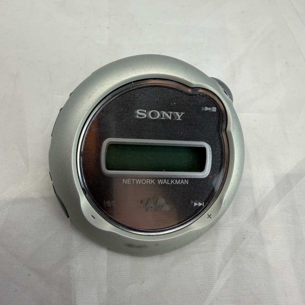 Sony Network Walkman NW-E107 Silver Digital MP3 Player 1GB Round Vintage Y2K
